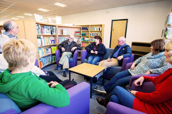 A reading group at an Aura Wales Library